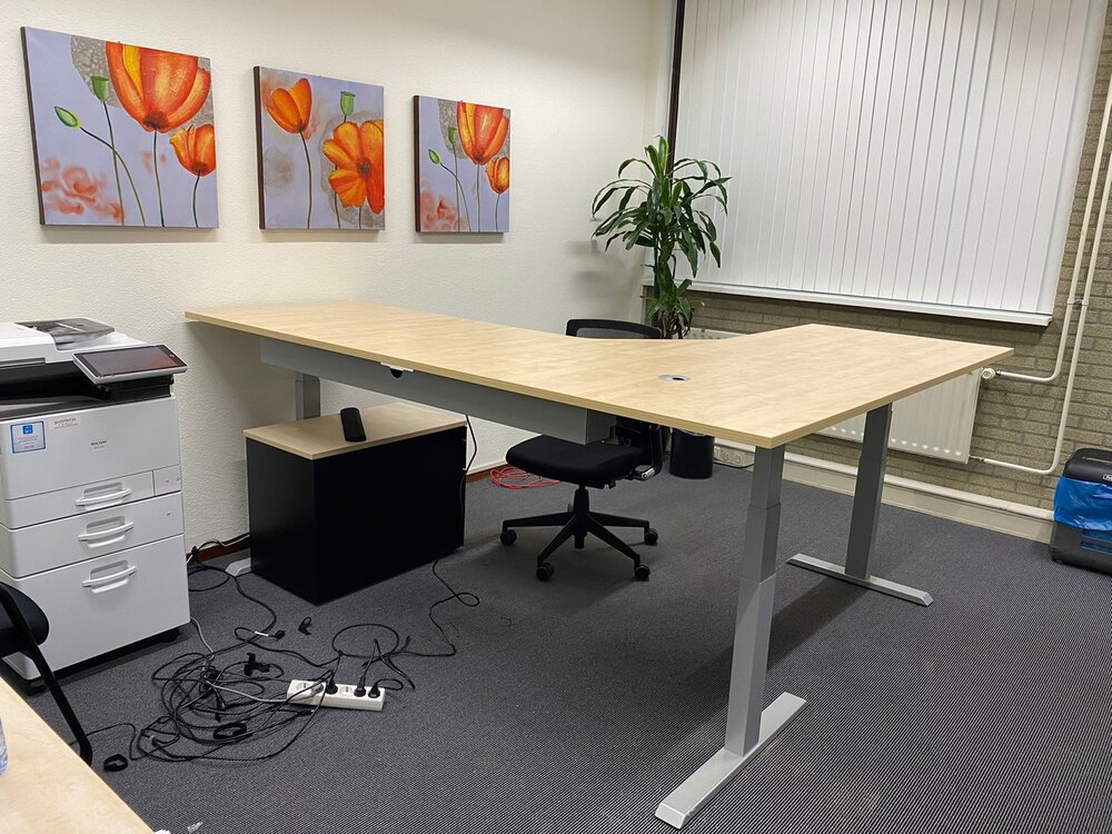 The desk and the chair sits in the corner top